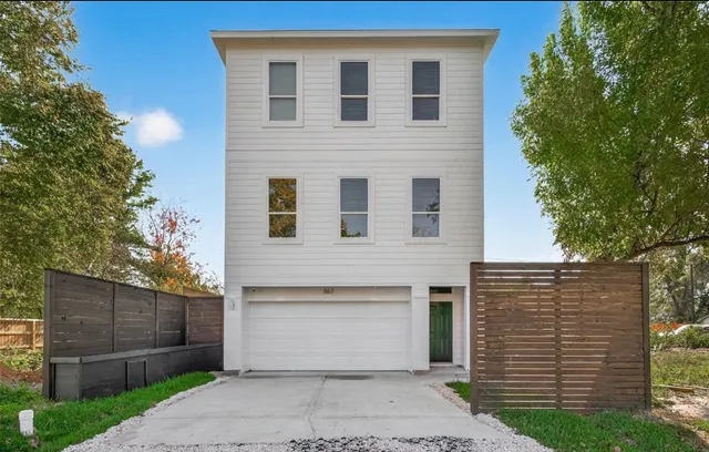 a front view of a house with garage