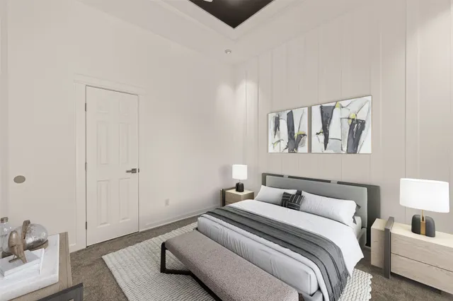 a bedroom with a bed and a couch