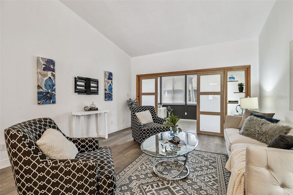 14773 Feather Cove Road Clearwater, FL 33762 - Photo 12 of 25 a living room with furniture and a large window
