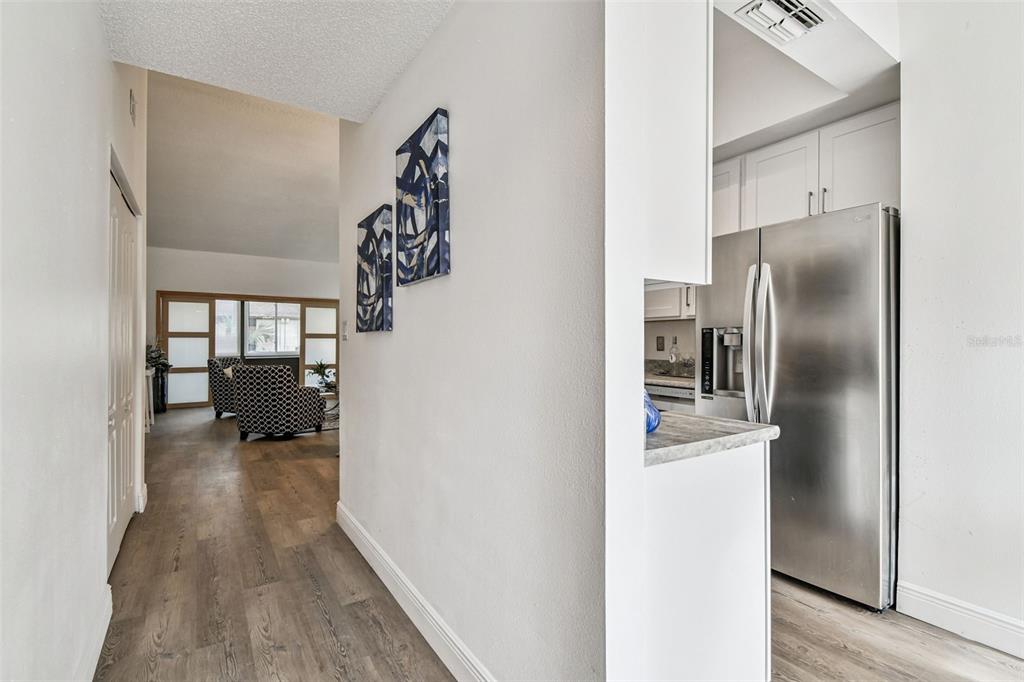 14773 Feather Cove Road Clearwater, FL 33762 - Photo 18 of 25 a kitchen with a refrigerator and window