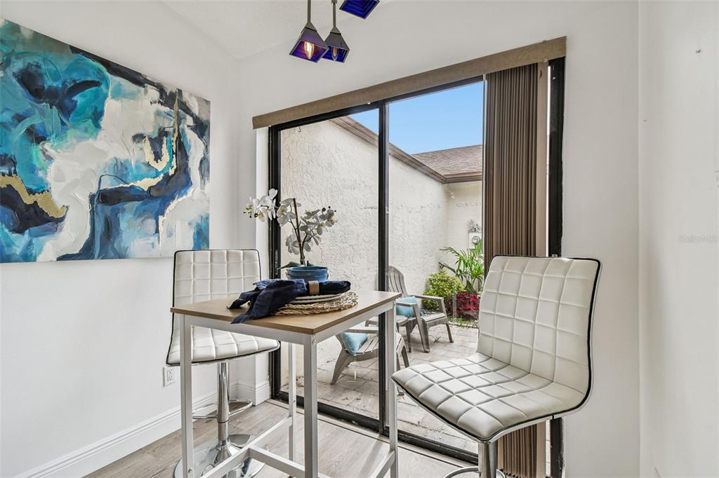 14773 Feather Cove Road Clearwater, FL 33762 - Photo 21 of 25 a living room with furniture and a window