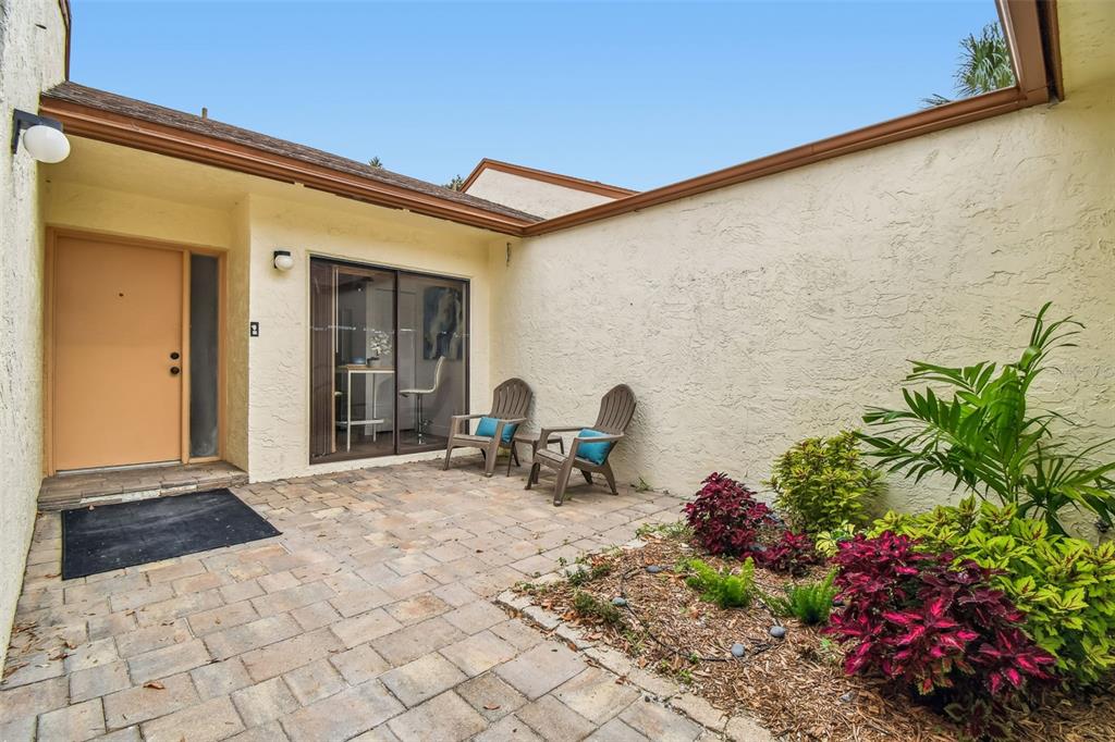 14773 Feather Cove Road Clearwater, FL 33762 - Photo 4 of 25 a backyard of a house with outdoor seating