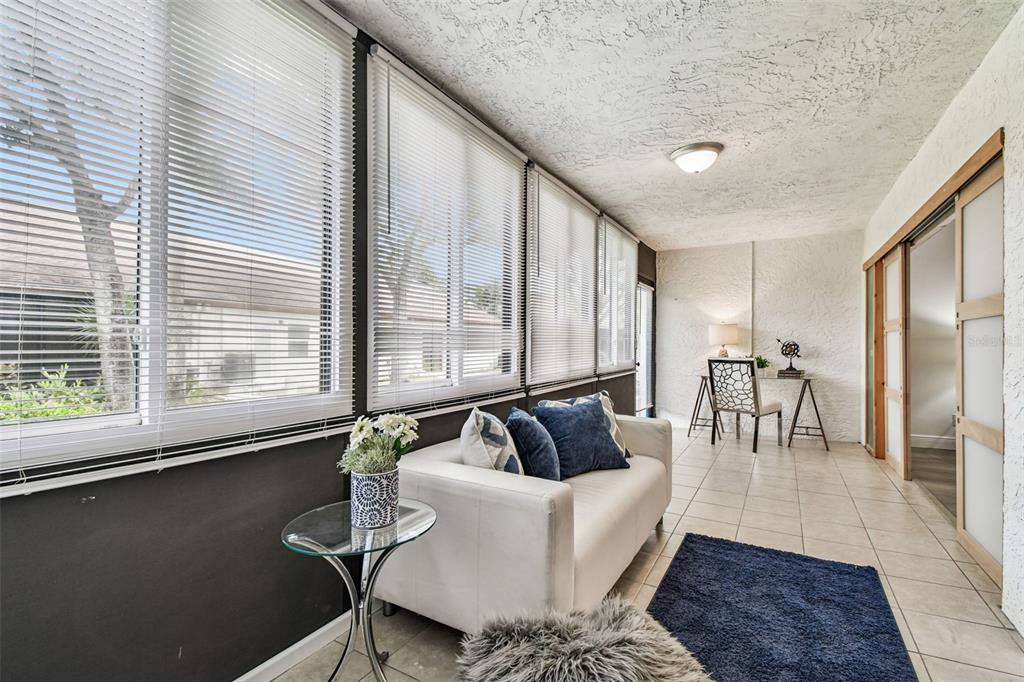14773 Feather Cove Road Clearwater, FL 33762 - Photo 5 of 25 a living room with furniture and large window