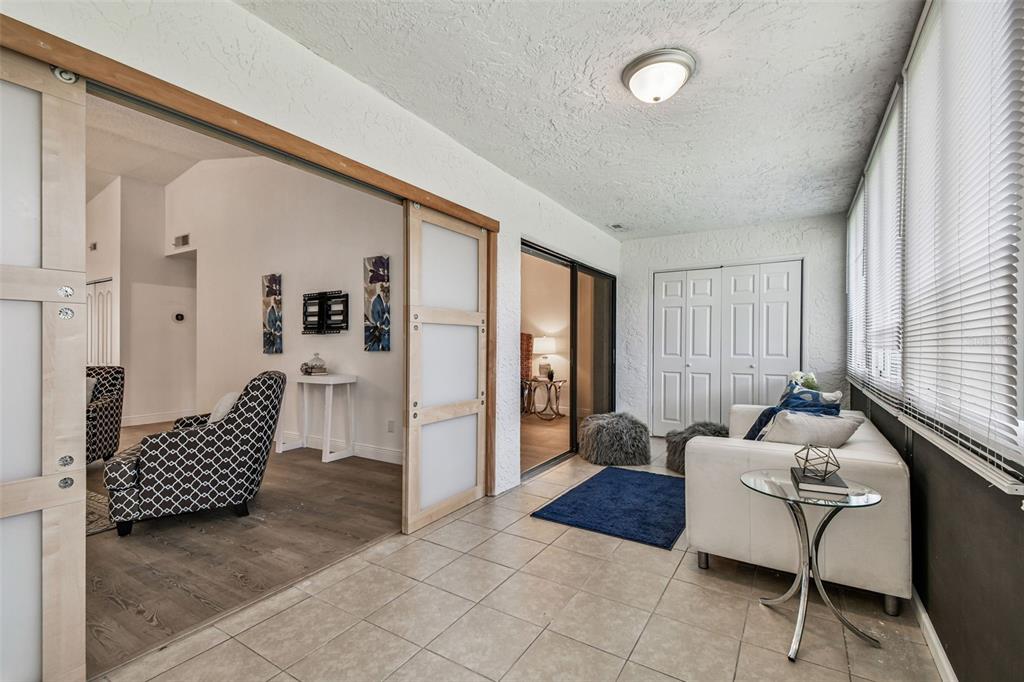 14773 Feather Cove Road Clearwater, FL 33762 - Photo 6 of 25 a living room with furniture and a window