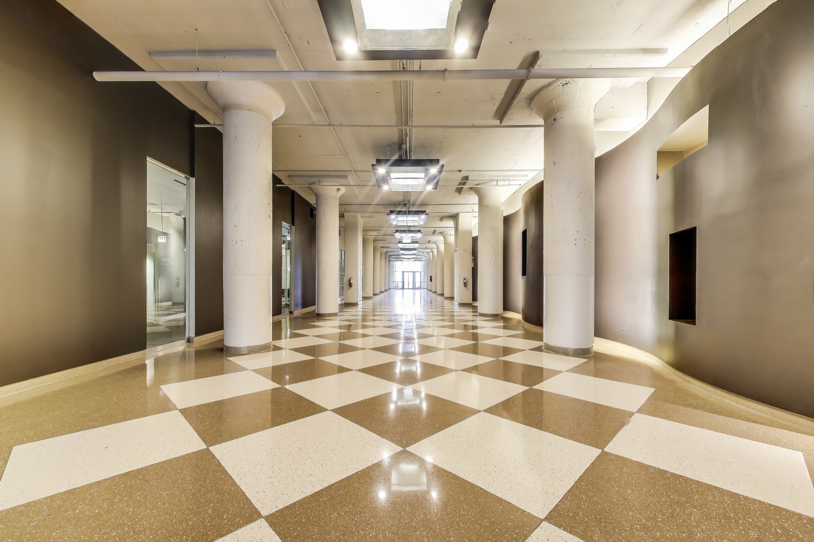 900 North Kingsbury Street, Unit 1019 Chicago, IL 60610 - Photo 2 of 37 a view of a hallway with a chandelier