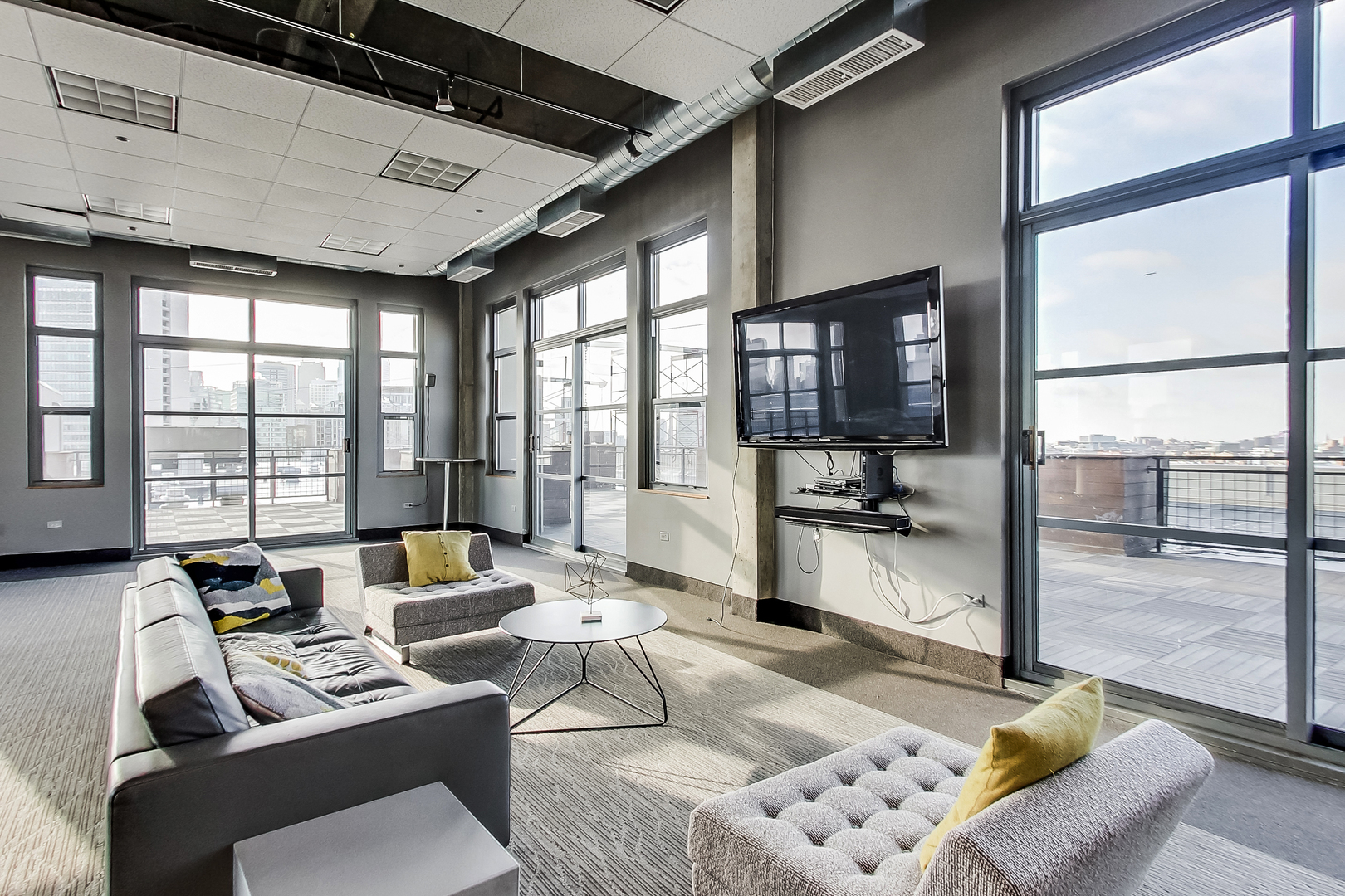 900 North Kingsbury Street, Unit 1019 Chicago, IL 60610 - Photo 27 of 37 a living room with furniture and a flat screen tv