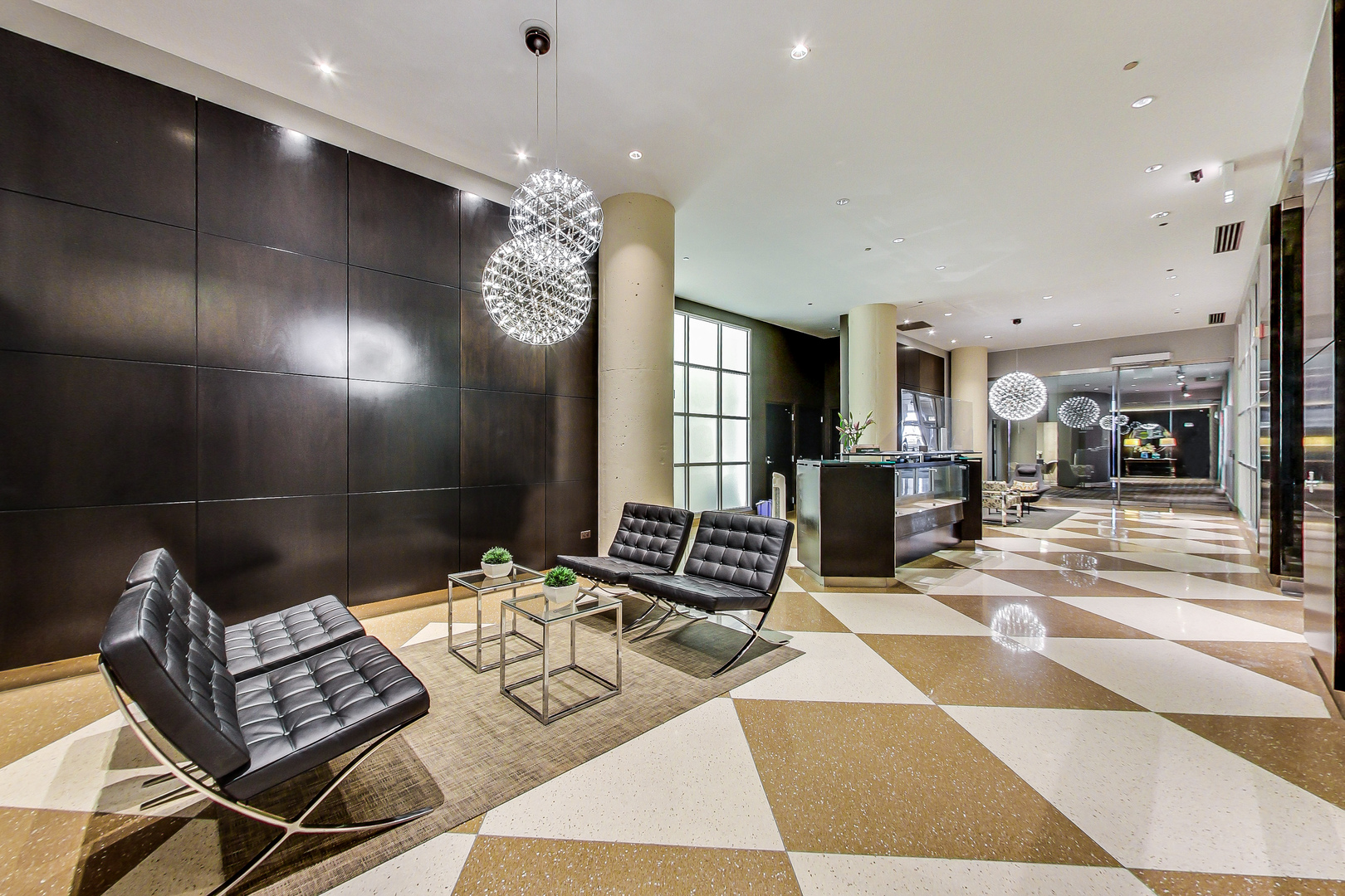 900 North Kingsbury Street, Unit 1019 Chicago, IL 60610 - Photo 3 of 37 a lobby with furniture and floor to ceiling window