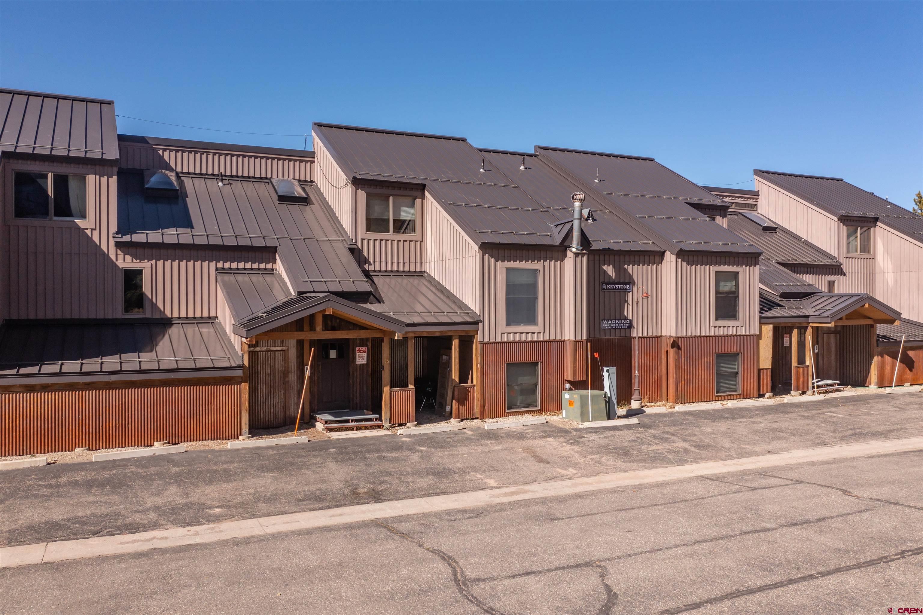 16 Hunter Hill Road, Unit K303 Crested Butte, CO 81225 - Photo 32 of 33 front view of a house with a street