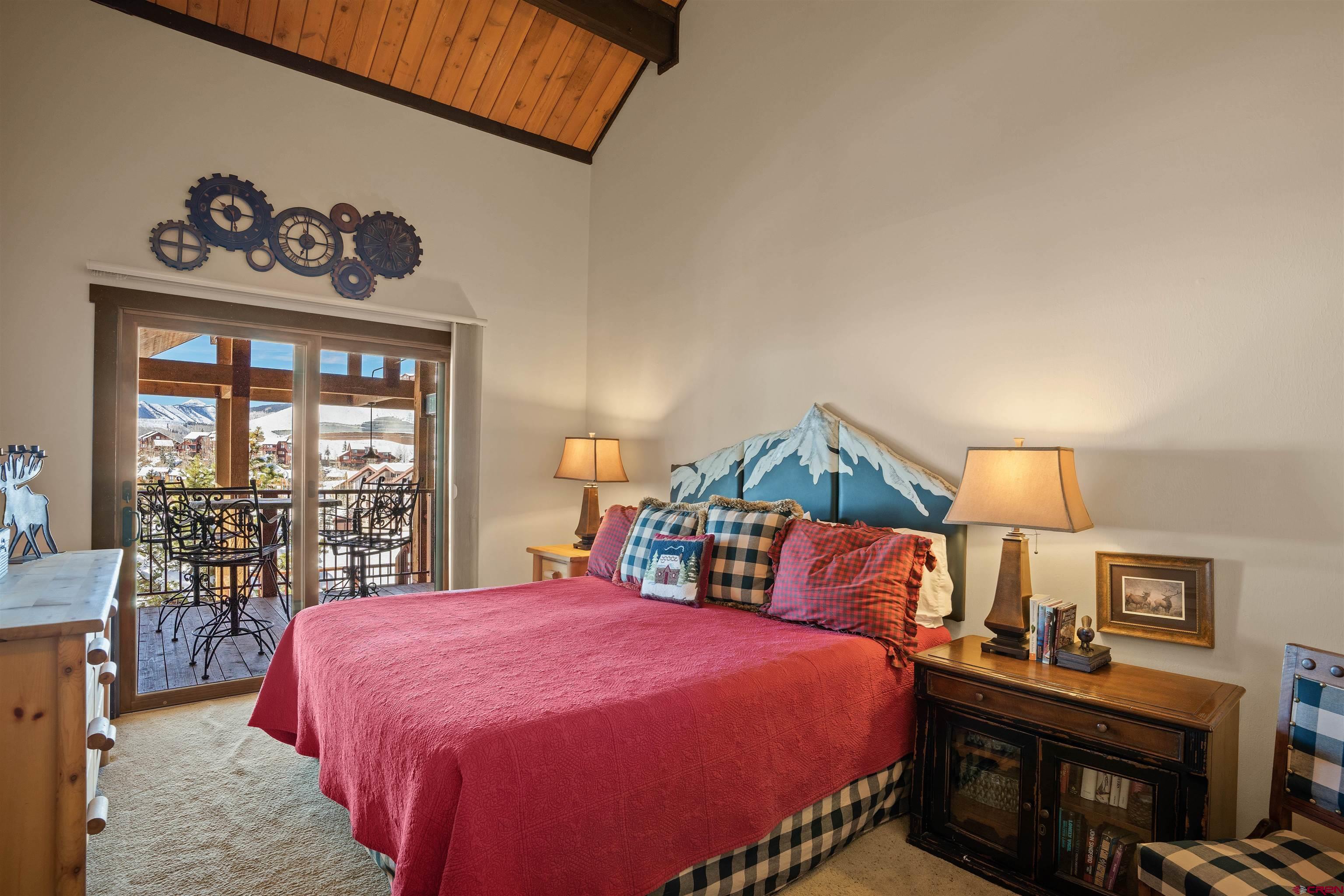 16 Hunter Hill Road, Unit K303 Crested Butte, CO 81225 - Photo 10 of 33 a bedroom with a bed and a large window