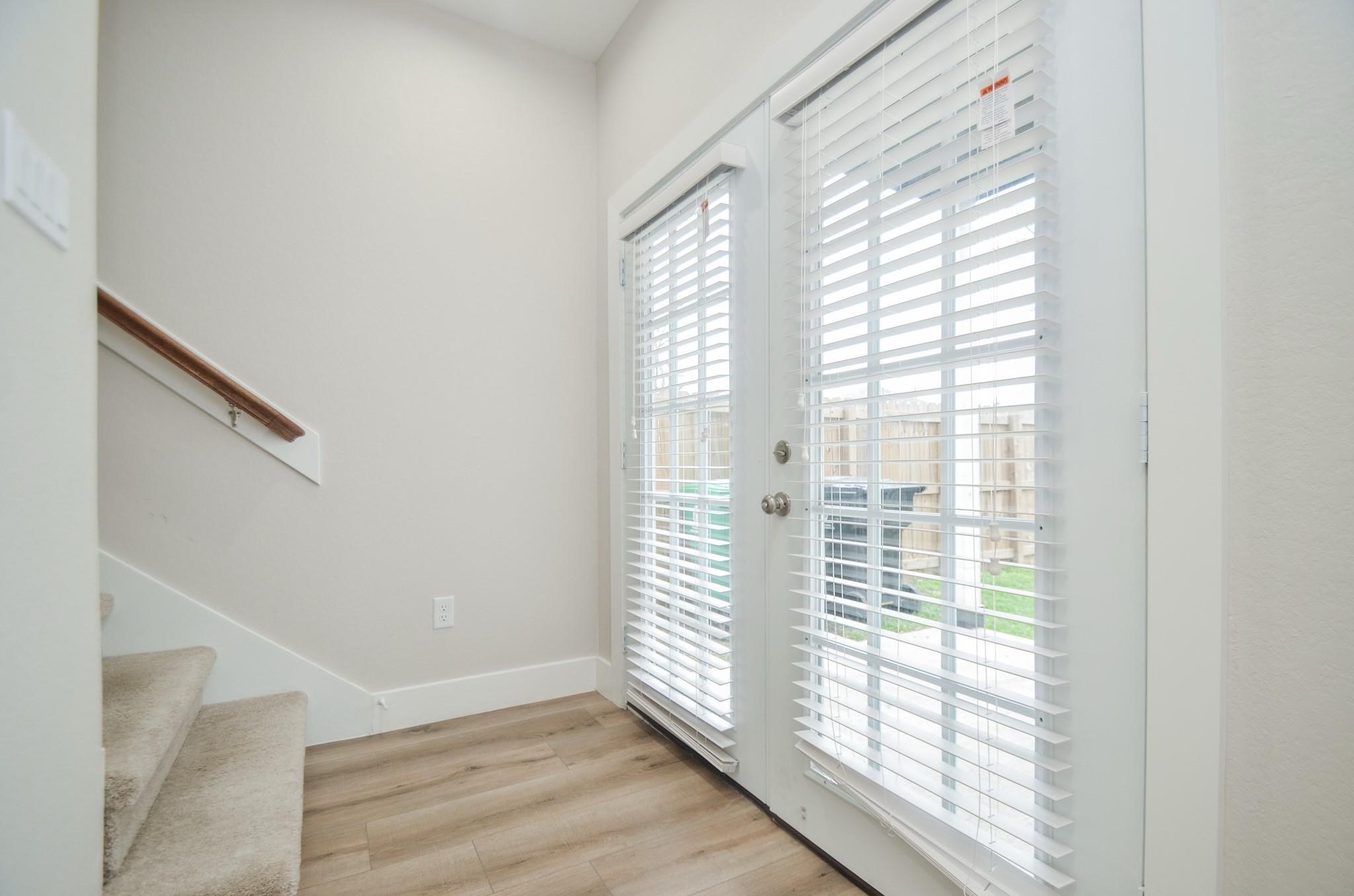 4511 Reed Road, Unit A Houston, TX 77051 - Photo 11 of 34 a view of empty room with wooden floor and fan