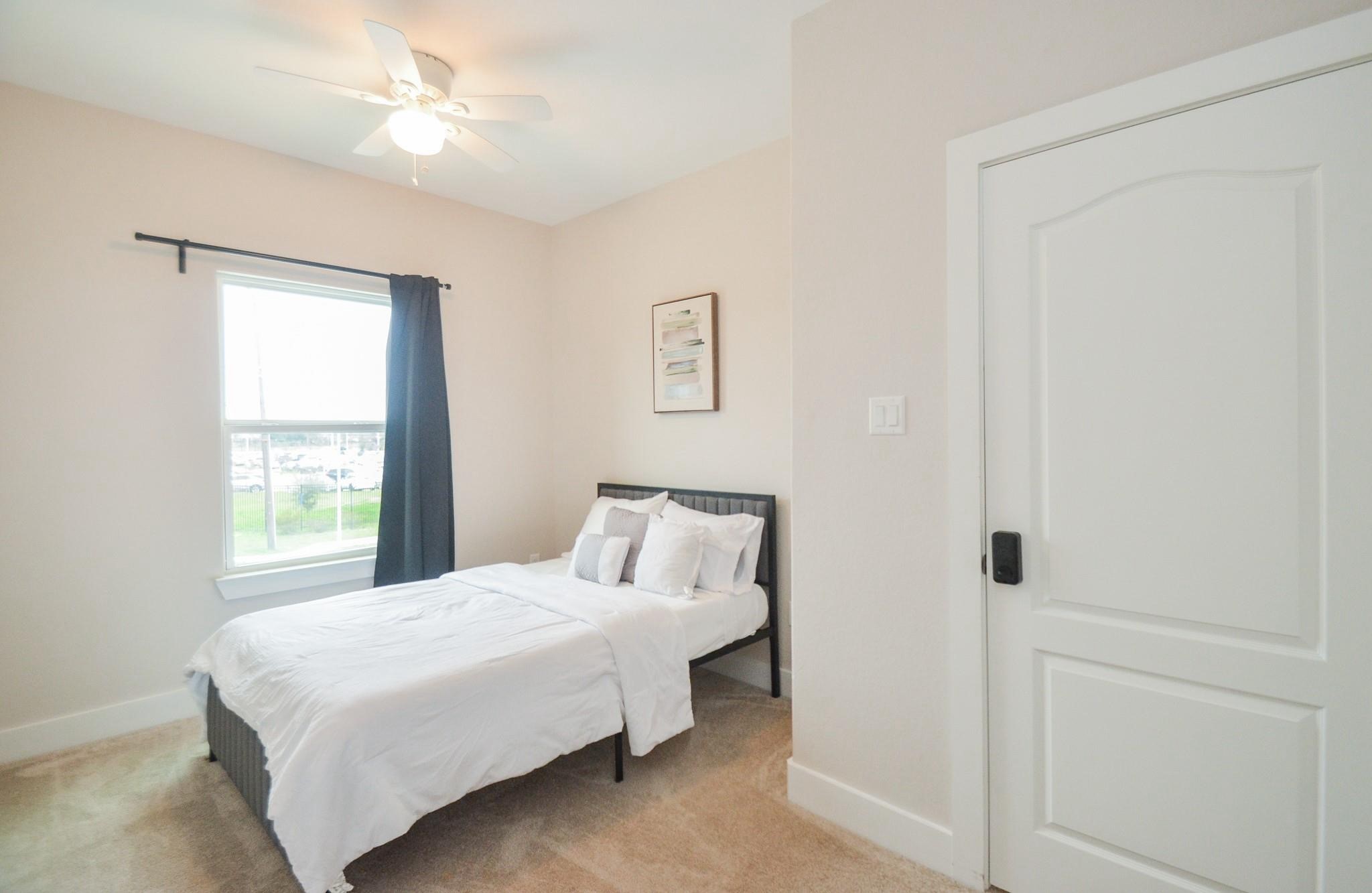 4511 Reed Road, Unit A Houston, TX 77051 - Photo 16 of 34 a bedroom with a bed and a window