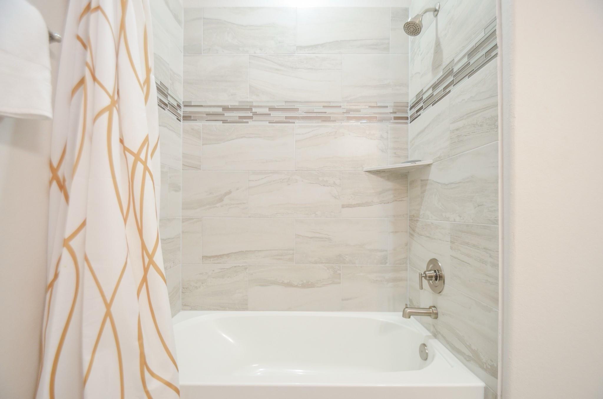 4511 Reed Road, Unit A Houston, TX 77051 - Photo 25 of 34 a bathroom with a bathtub