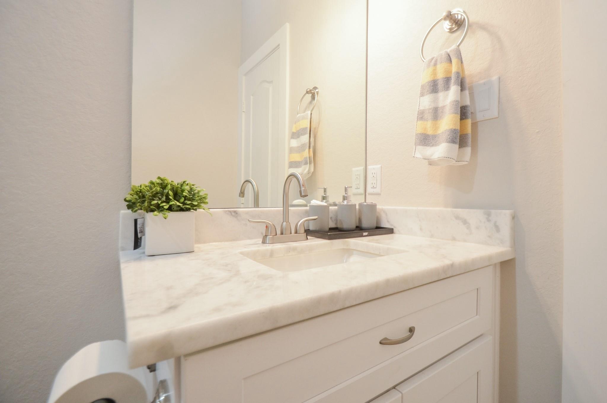 4511 Reed Road, Unit A Houston, TX 77051 - Photo 30 of 34 a bathroom with a granite countertop sink and a mirror