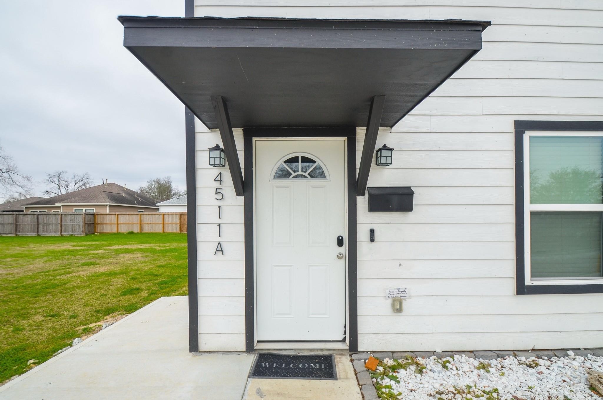 4511 Reed Road, Unit A Houston, TX 77051 - Photo 7 of 34 a front view of a house with a yard
