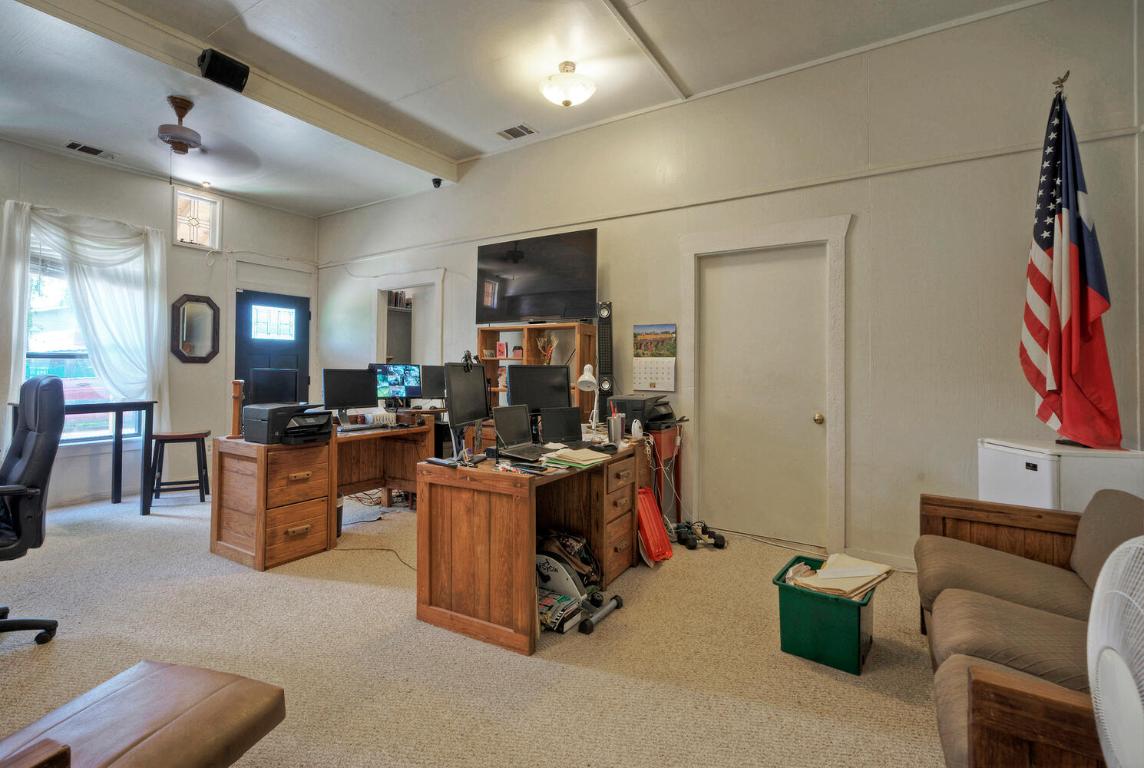906-828 Water Street Manor, TX 78653 - Photo 12 of 40 a view of a livingroom with workspace and a couch
