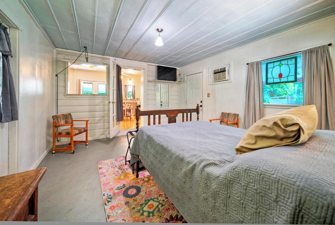 906-828 Water Street Manor, TX 78653 - Photo 28 of 40 a bedroom with furniture and a window