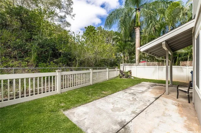 a view of a backyard with a sitting area