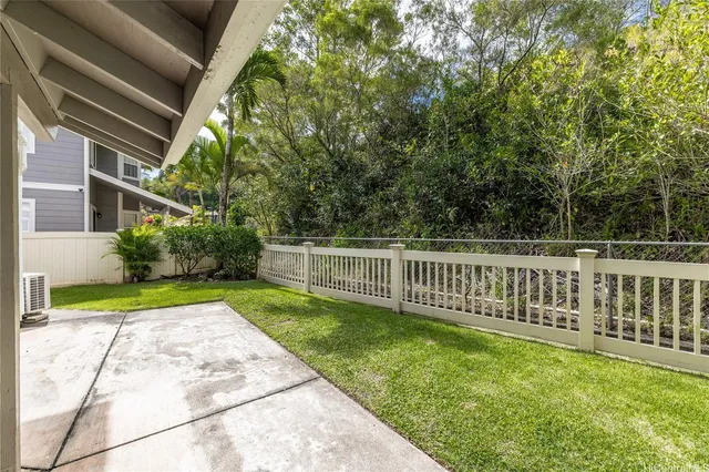 a view of a backyard with a small cabin