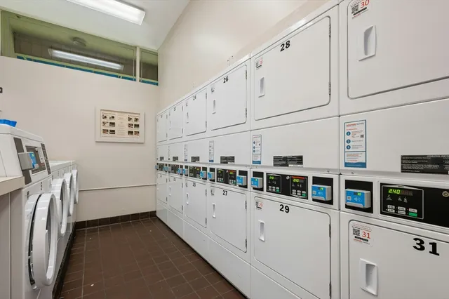 a kitchen with stainless steel appliances a refrigerator and a stove top oven