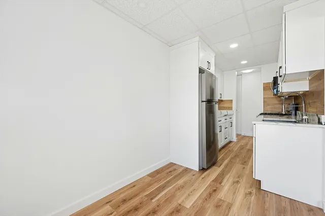 a view of kitchen with wooden floor