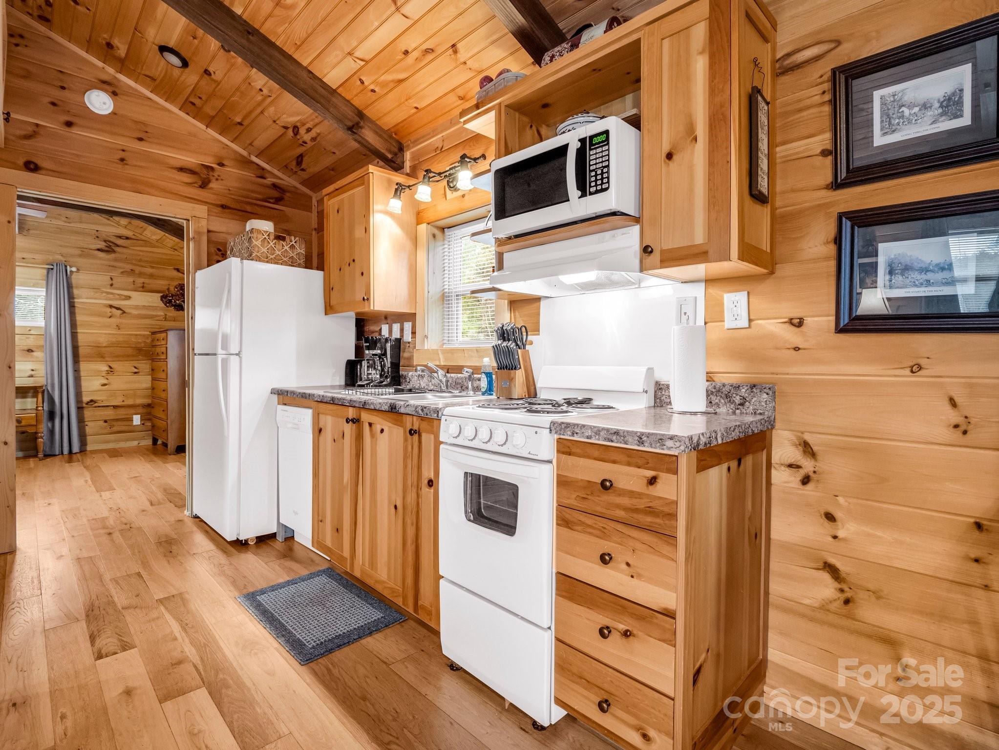 1217 Moore Road, Unit 70 80 & 90 Tryon, NC 28782 - Photo 15 of 42 a kitchen with stainless steel appliances granite countertop a stove and a refrigerator