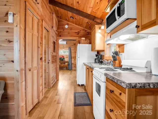 a kitchen with stainless steel appliances granite countertop a sink and cabinets