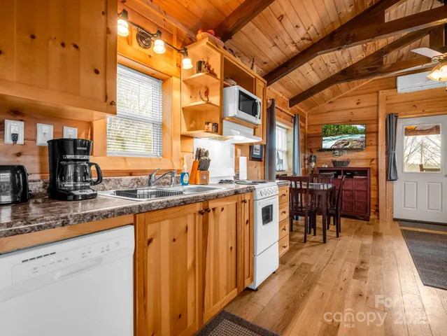 a very nice looking kitchen with a large window