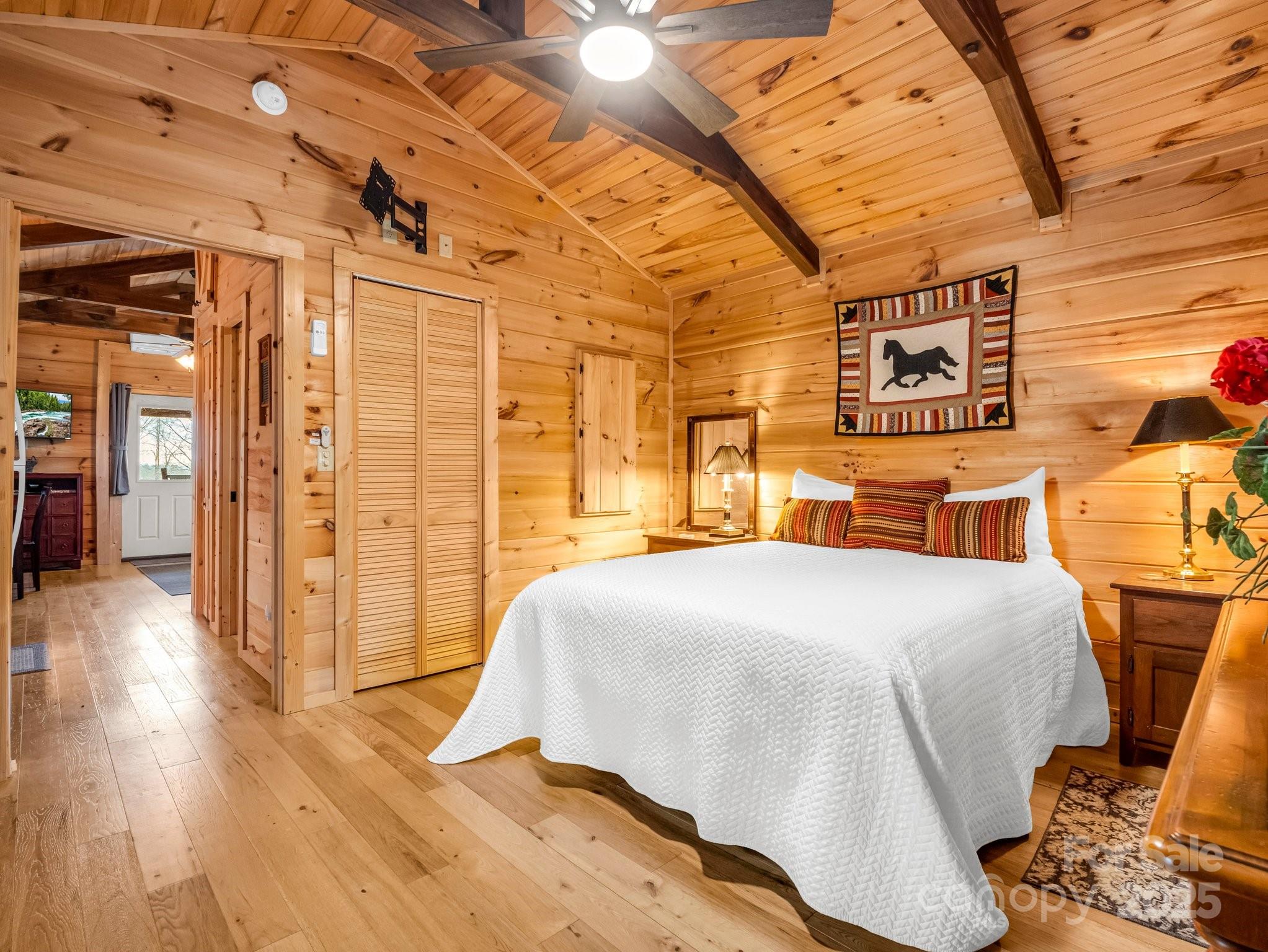 1217 Moore Road, Unit 70 80 & 90 Tryon, NC 28782 - Photo 18 of 42 a bedroom with a bed and wooden floor