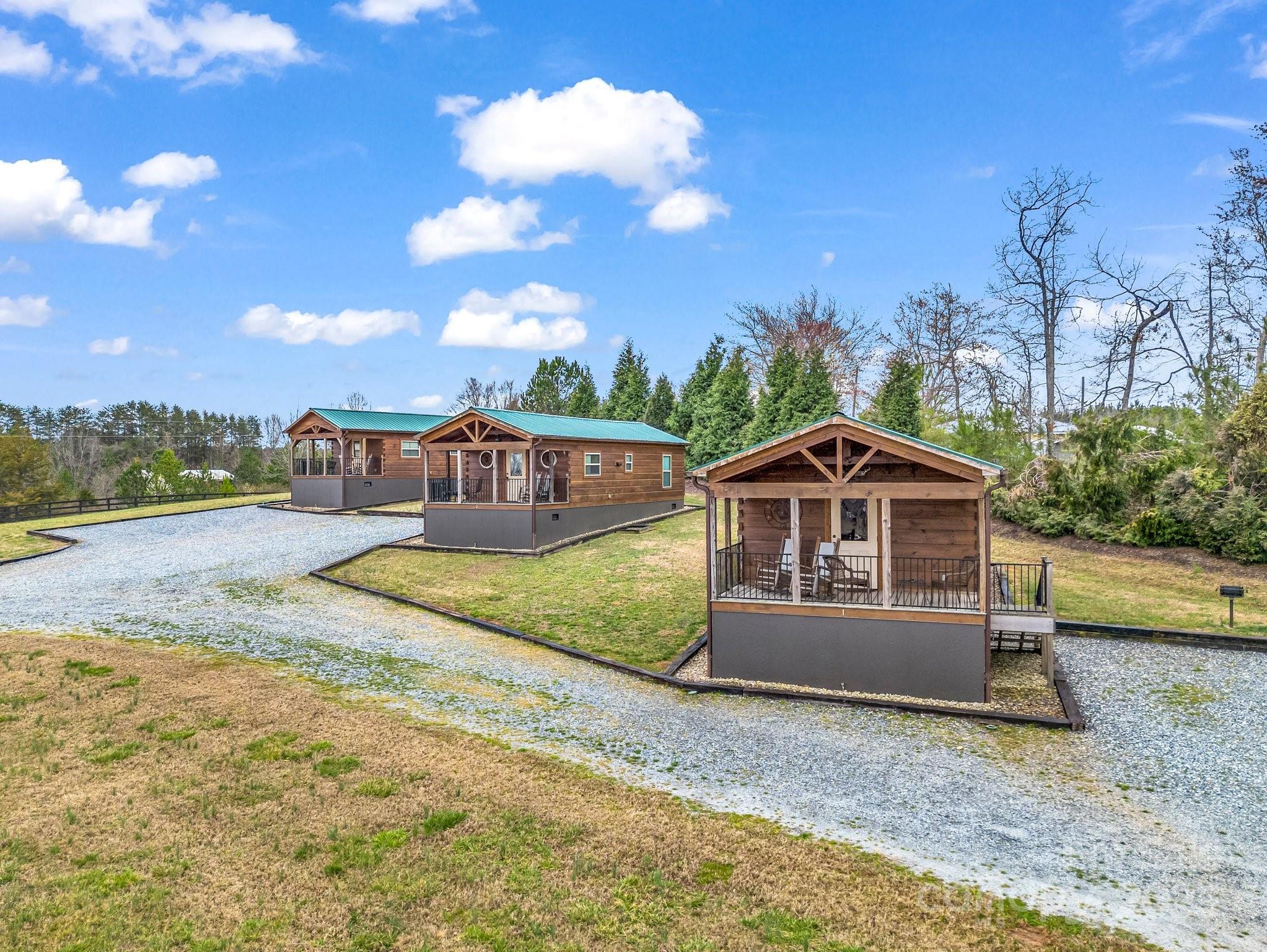 1217 Moore Road, Unit 70 80 & 90 Tryon, NC 28782 - Photo 2 of 42 a view of a house with a yard