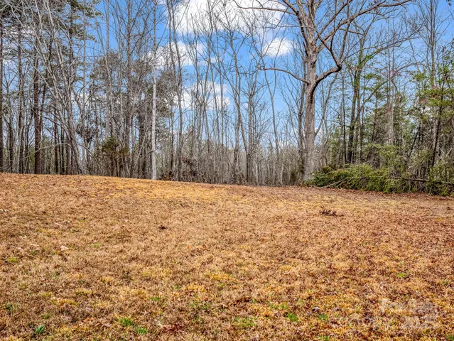 a view of wooden fence of a house