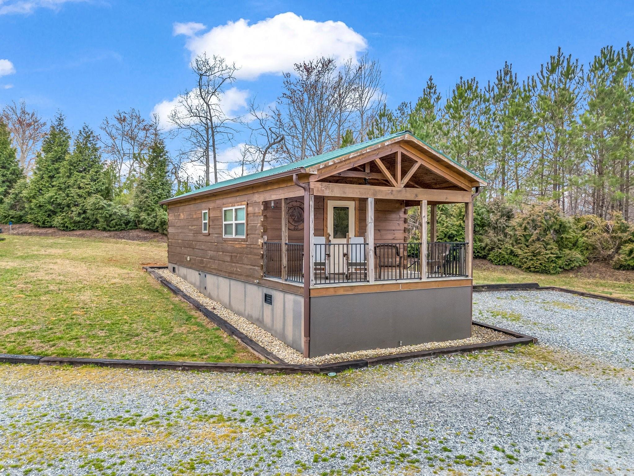 1217 Moore Road, Unit 70 80 & 90 Tryon, NC 28782 - Photo 37 of 42 a view of a house with a yard and balcony