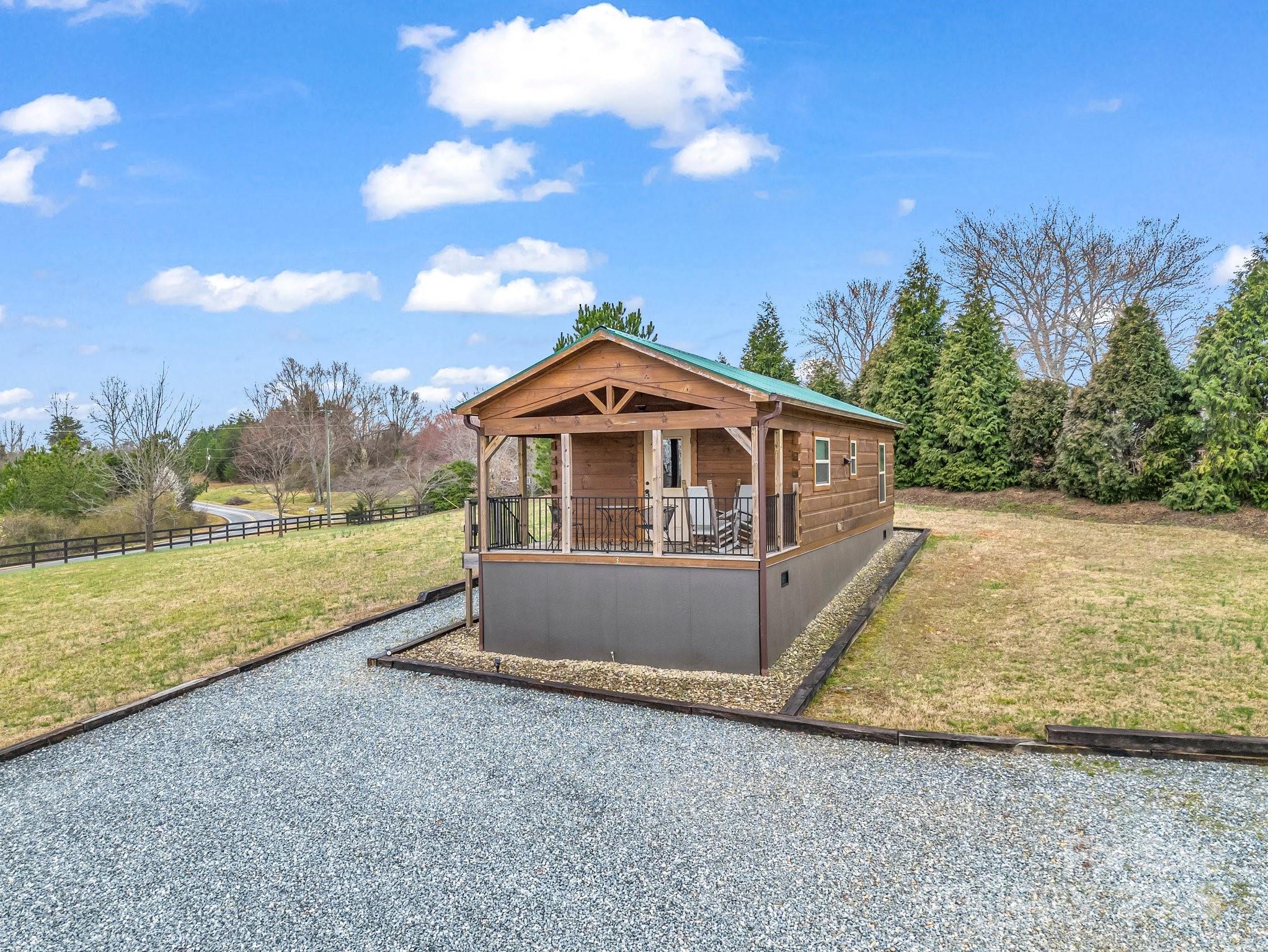 1217 Moore Road, Unit 70 80 & 90 Tryon, NC 28782 - Photo 40 of 42 a front view of a house with a yard