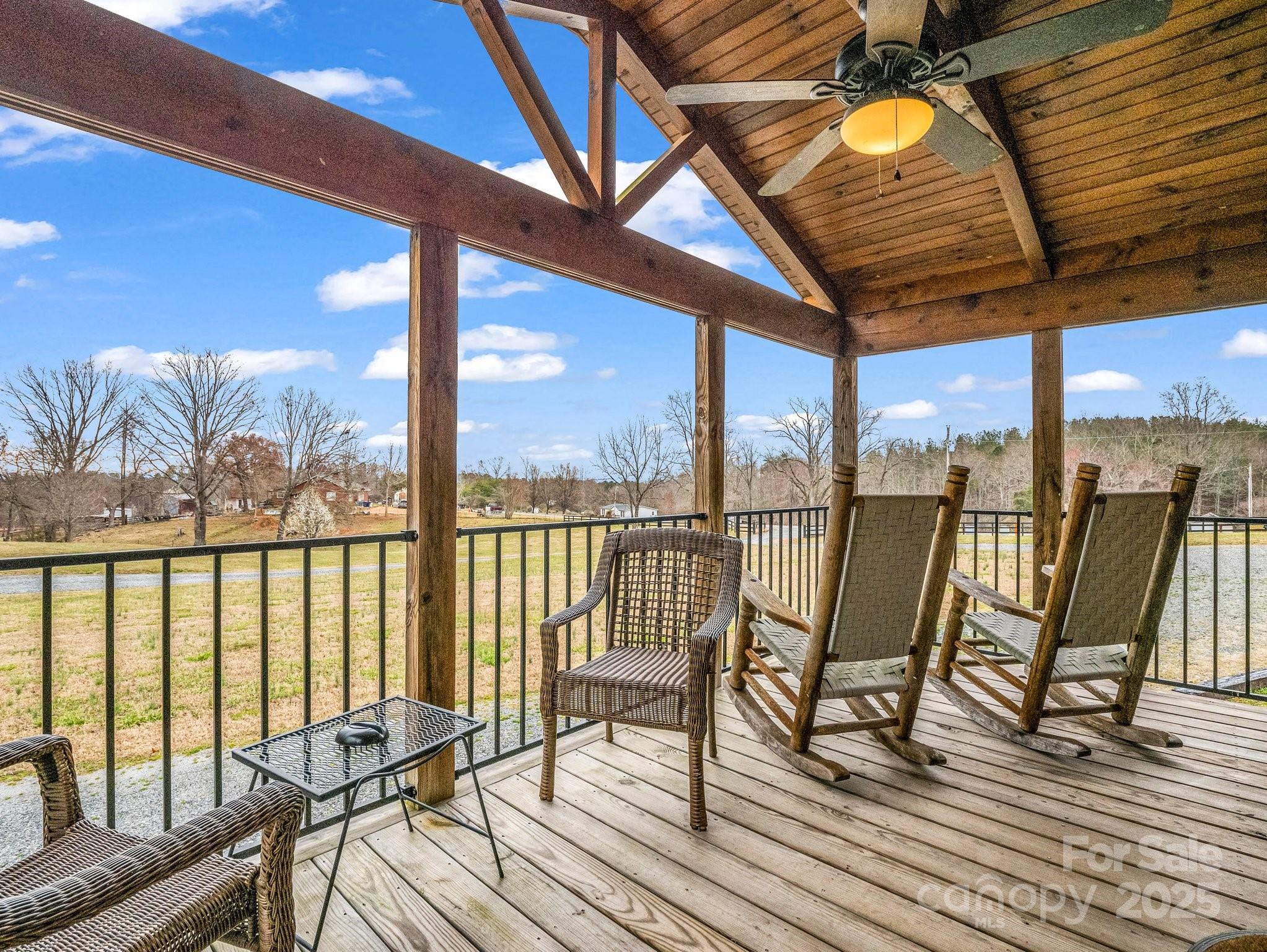 1217 Moore Road, Unit 70 80 & 90 Tryon, NC 28782 - Photo 6 of 42 a view of a balcony with furniture and wooden floor