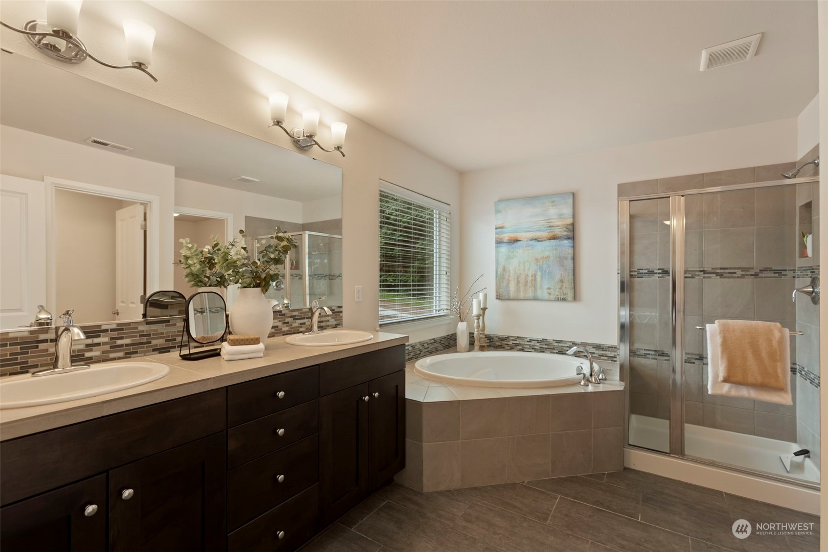 19529 34th Drive Southeast Bothell, WA 98012 - Photo 21 of 38 a bathroom with a double vanity sink bathtub large mirror and shower