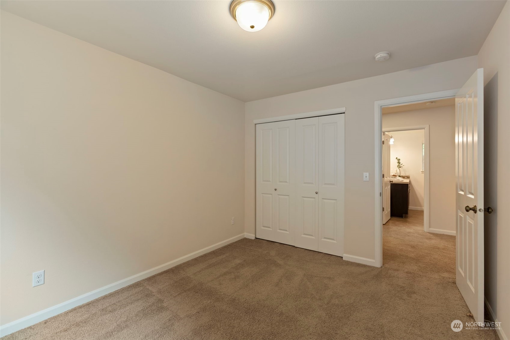 19529 34th Drive Southeast Bothell, WA 98012 - Photo 29 of 38 an empty room with closet and mirror