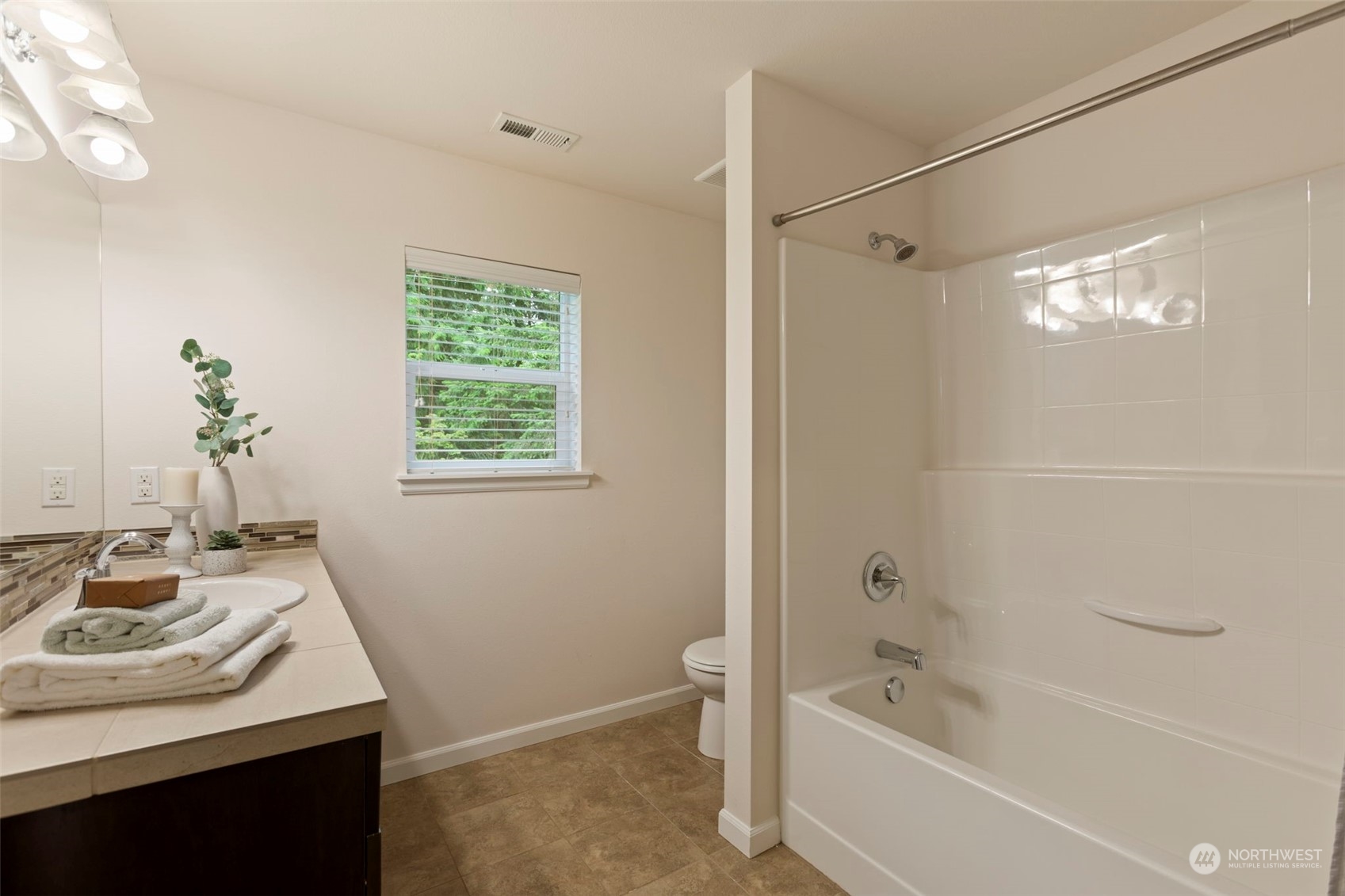 19529 34th Drive Southeast Bothell, WA 98012 - Photo 30 of 38 a bathroom with a sink a bathtub and a shower