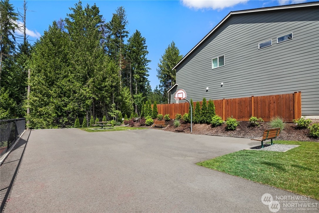 19529 34th Drive Southeast Bothell, WA 98012 - Photo 36 of 38 a view of a house with backyard and garage