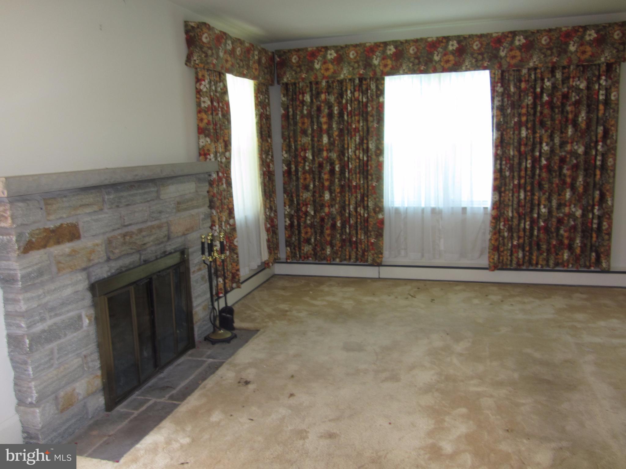 11802 Manor Road Glen Arm, MD 21057 - Photo 2 of 21 Living Room with Stone Fireplace