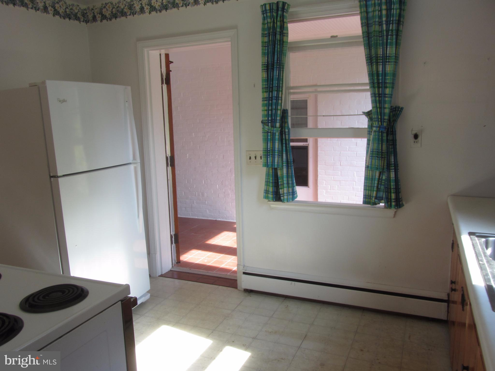 11802 Manor Road Glen Arm, MD 21057 - Photo 7 of 21 Kitchen to Sunny Three Season Room