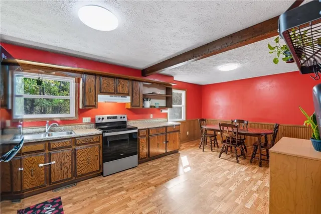 a kitchen with lots of counter top space and dining table