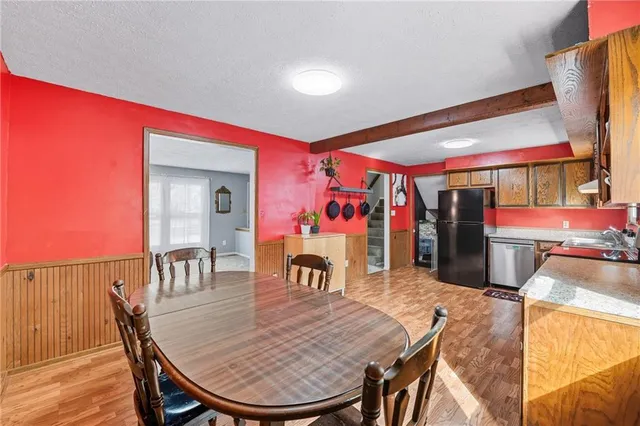 a dining room with a table and chairs