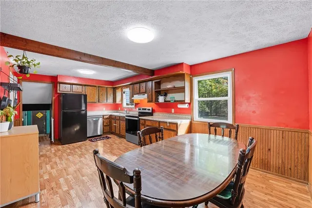 a dining room with furniture and window