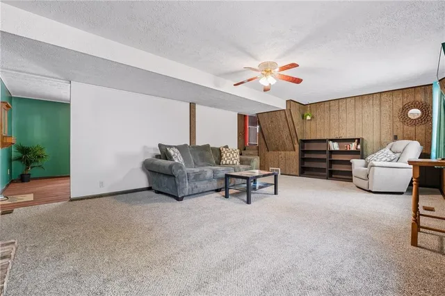 a living room with furniture and a lamp