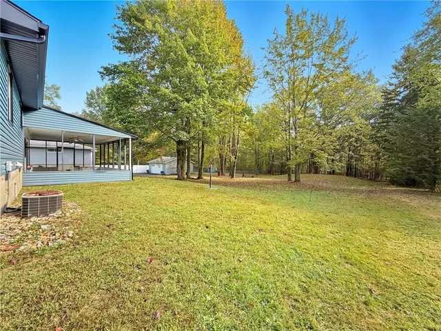 a house view with swimming pool in front