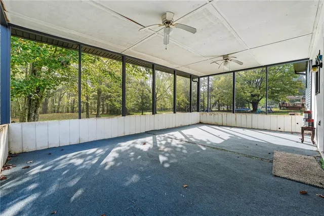 a view of an empty room with a balcony