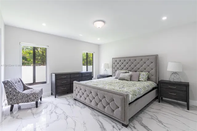 a bedroom with a bed and a couch