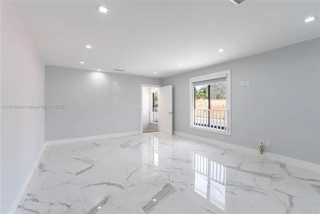 a view of an empty room and window