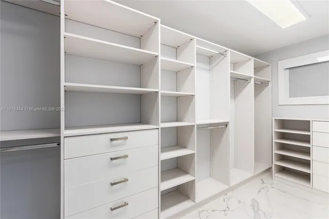 a view of an empty walk in closet