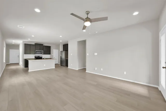a view of a kitchen with a sink and a stove top oven