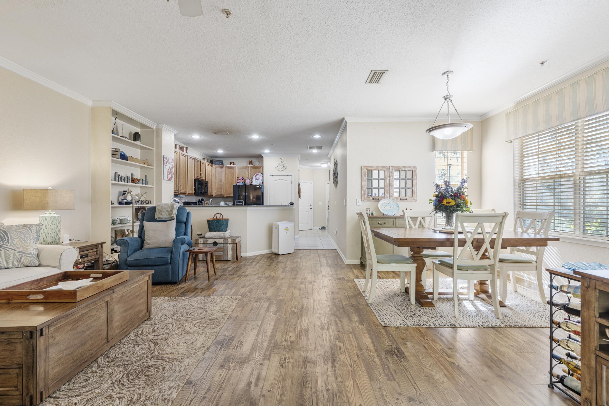 110 Magnolia Crossing Point, Unit 1901 St. Augustine, FL 32086 - Photo 10 of 38 Dining room featuring light wood-type flooring, ornamental molding, a textured ceiling, and recessed lighting